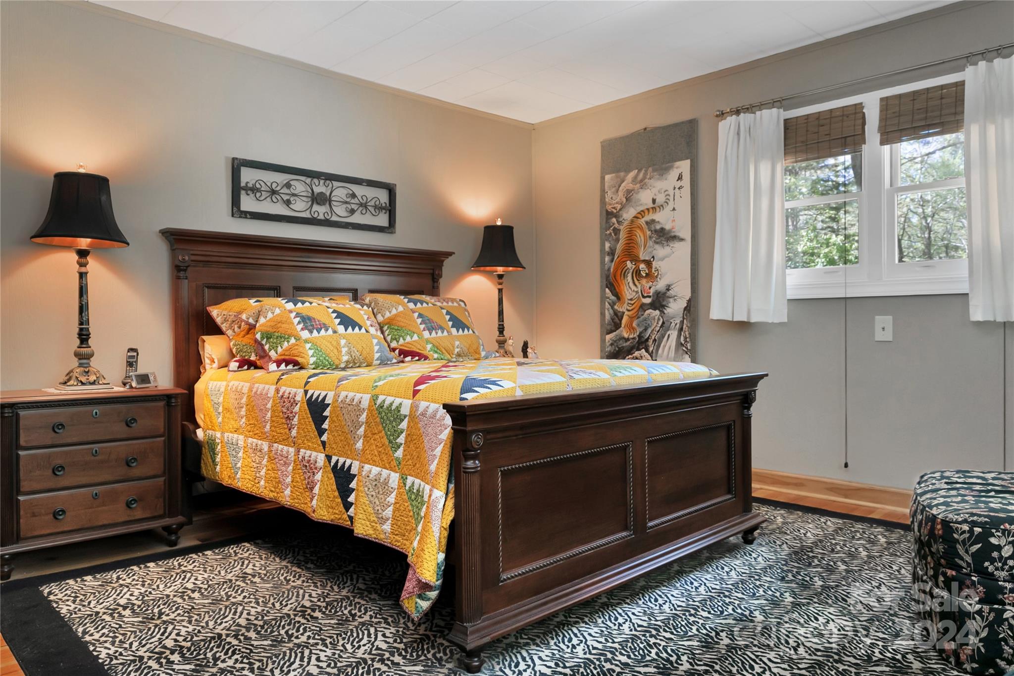 50 Summer Road Cedar Mountain, NC 28718 - Photo 19 of 41 a bed sitting in a bedroom next to a window with lamp