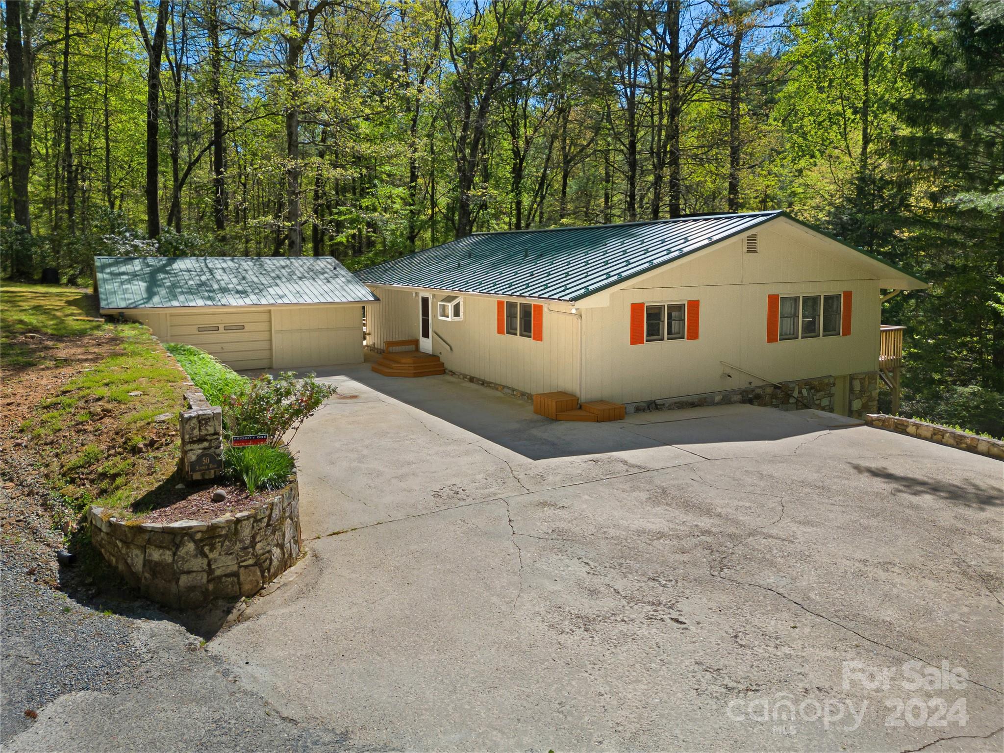 50 Summer Road Cedar Mountain, NC 28718 - Photo 2 of 41 a house view with a backyard space