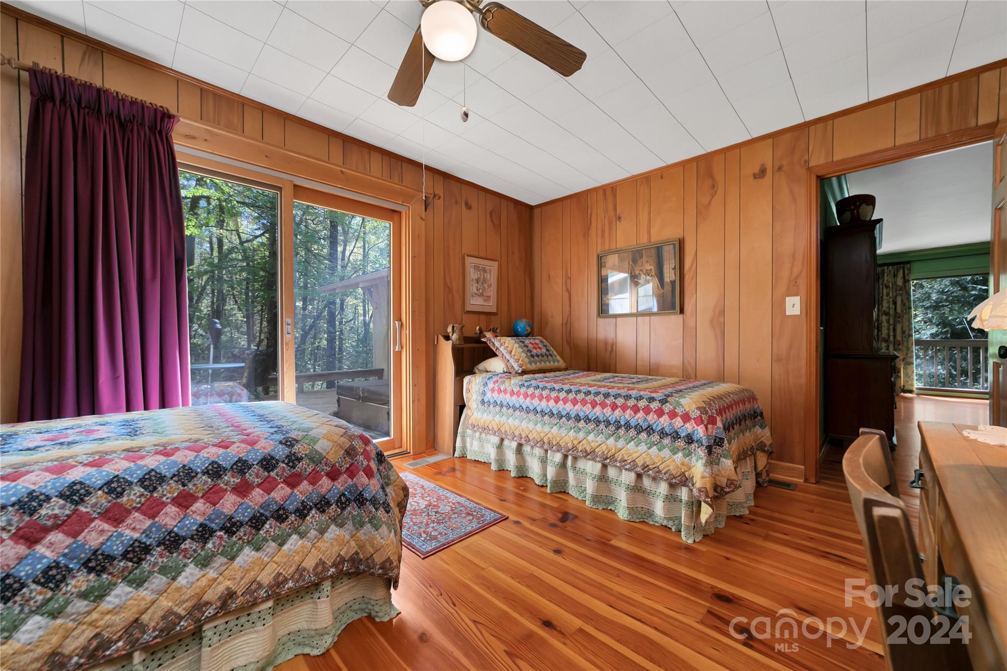 50 Summer Road Cedar Mountain, NC 28718 - Photo 25 of 41 a bedroom with a bed and wooden floor