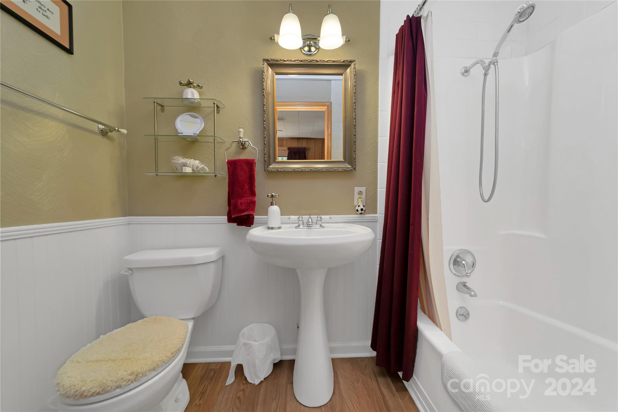 50 Summer Road Cedar Mountain, NC 28718 - Photo 26 of 41 a bathroom with a sink a toilet and shower curtain