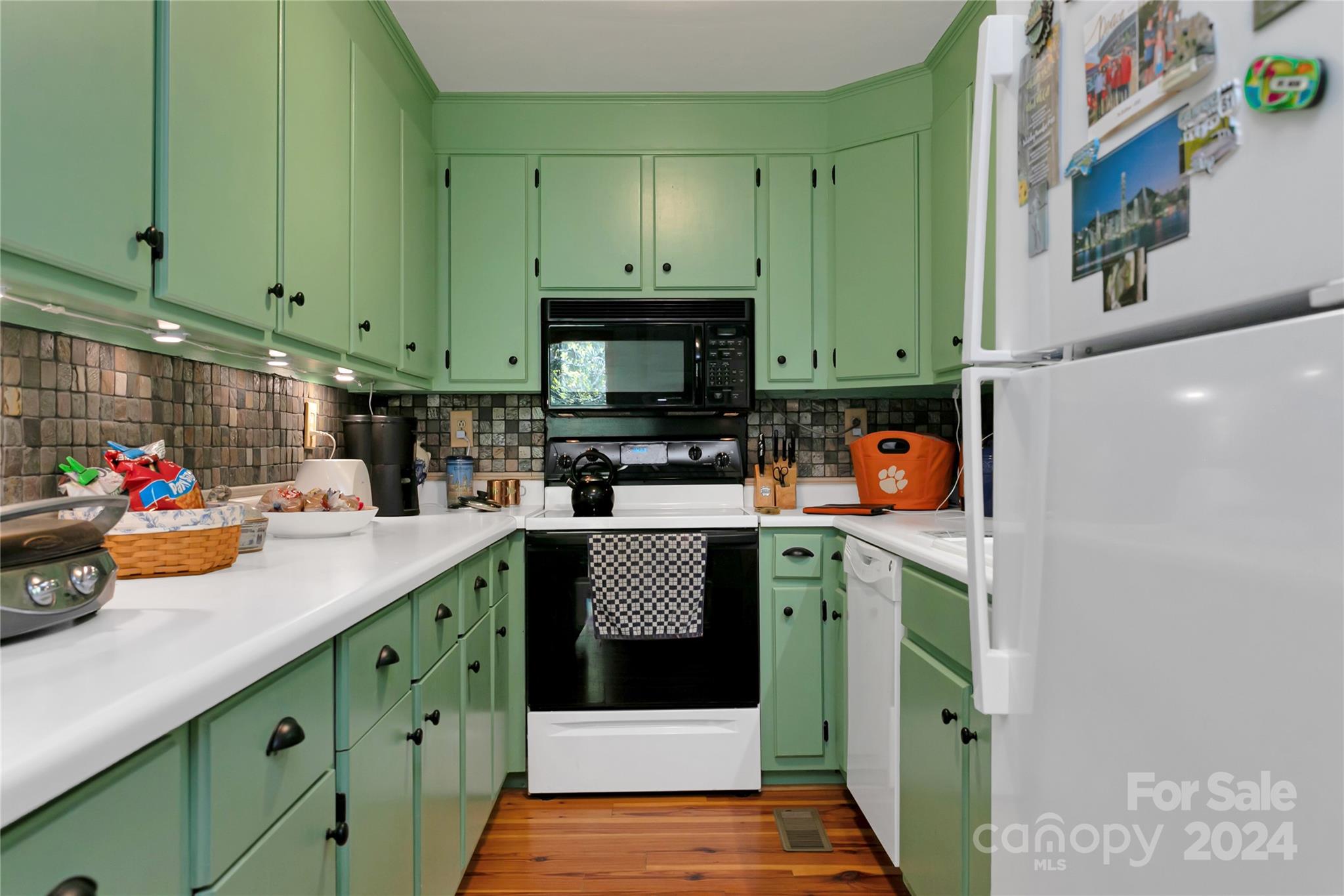 50 Summer Road Cedar Mountain, NC 28718 - Photo 28 of 41 a kitchen with stainless steel appliances a stove a sink and a refrigerator