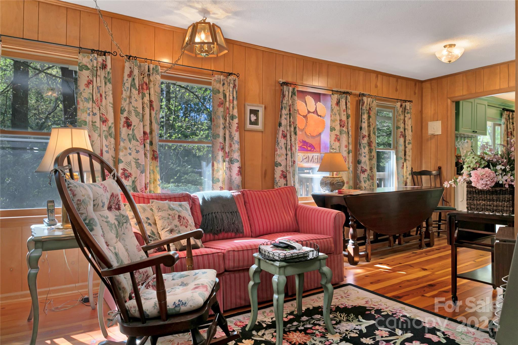 50 Summer Road Cedar Mountain, NC 28718 - Photo 30 of 41 a living room with furniture a rug and a floor to ceiling window