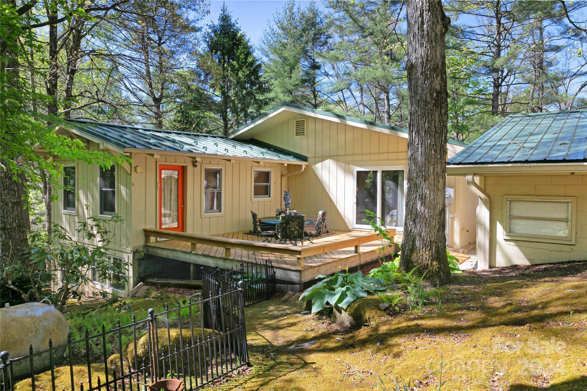 50 Summer Road Cedar Mountain, NC 28718 - Photo 37 of 41 a view of a house with backyard and sitting area