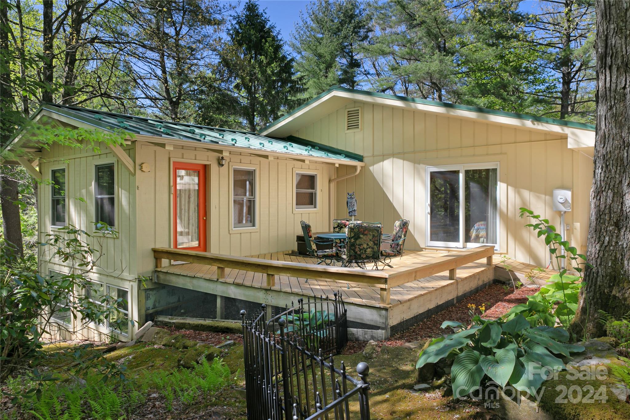 50 Summer Road Cedar Mountain, NC 28718 - Photo 5 of 41 a front view of house with yard outdoor seating and yard