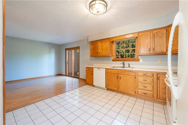 a view of a hallway with entryway door