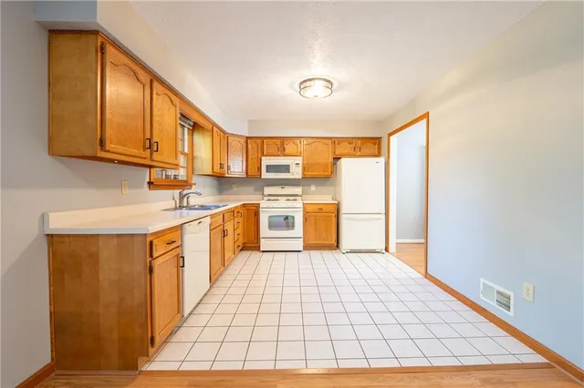 an empty room with a ceiling fan and a window