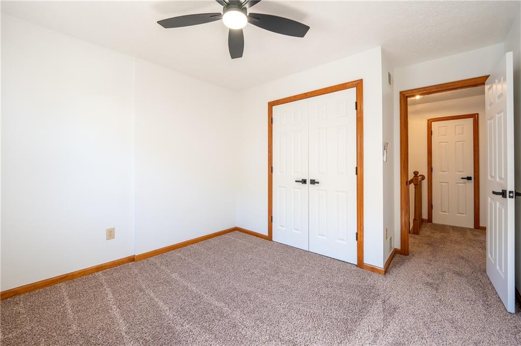 108 Unity Square Greensburg, PA 15601 - Photo 19 of 43 an empty room with a ceiling fan and a window