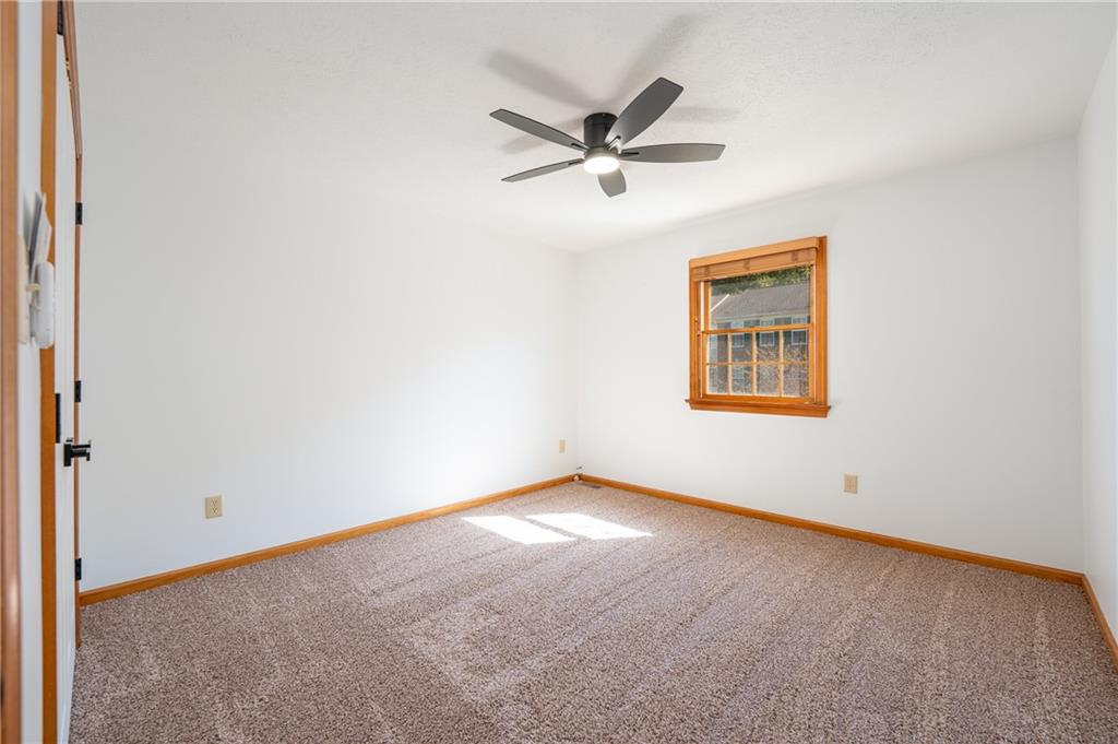 108 Unity Square Greensburg, PA 15601 - Photo 20 of 43 an empty room with a window and a fan