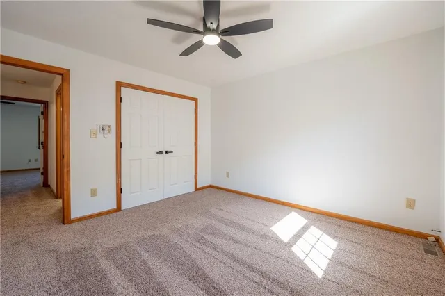 a front view of a house with a yard and a garage