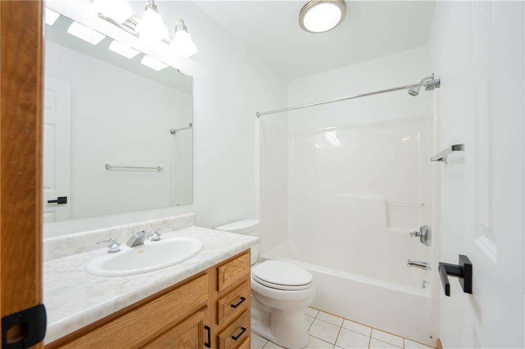 108 Unity Square Greensburg, PA 15601 - Photo 23 of 43 a bathroom with a granite countertop sink a toilet and shower
