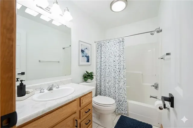 an aerial view of multiple houses with yard