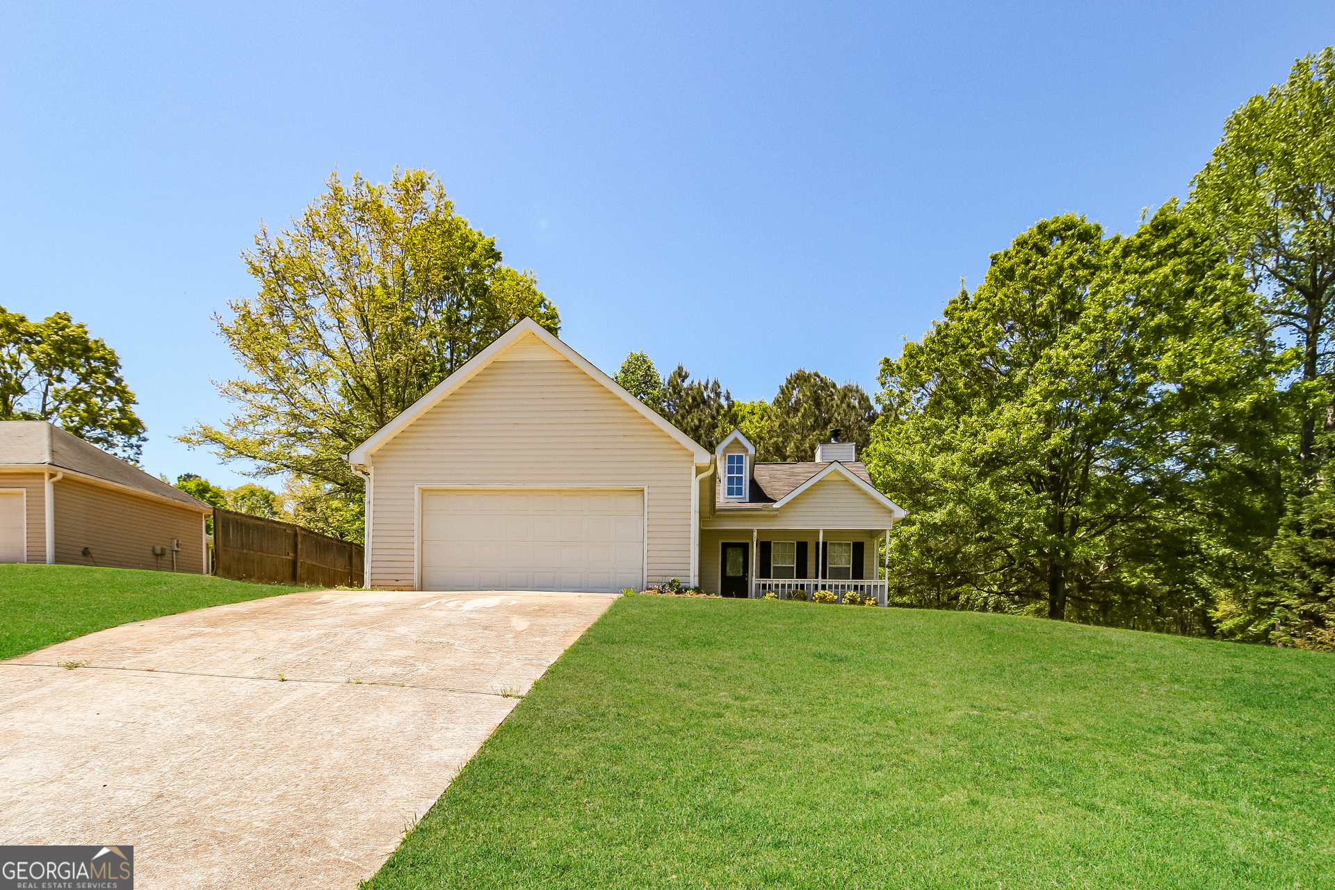 460 Mountainview Drive Covington, GA 30016 - Photo 1 of 15 a front view of a house with a yard and garage