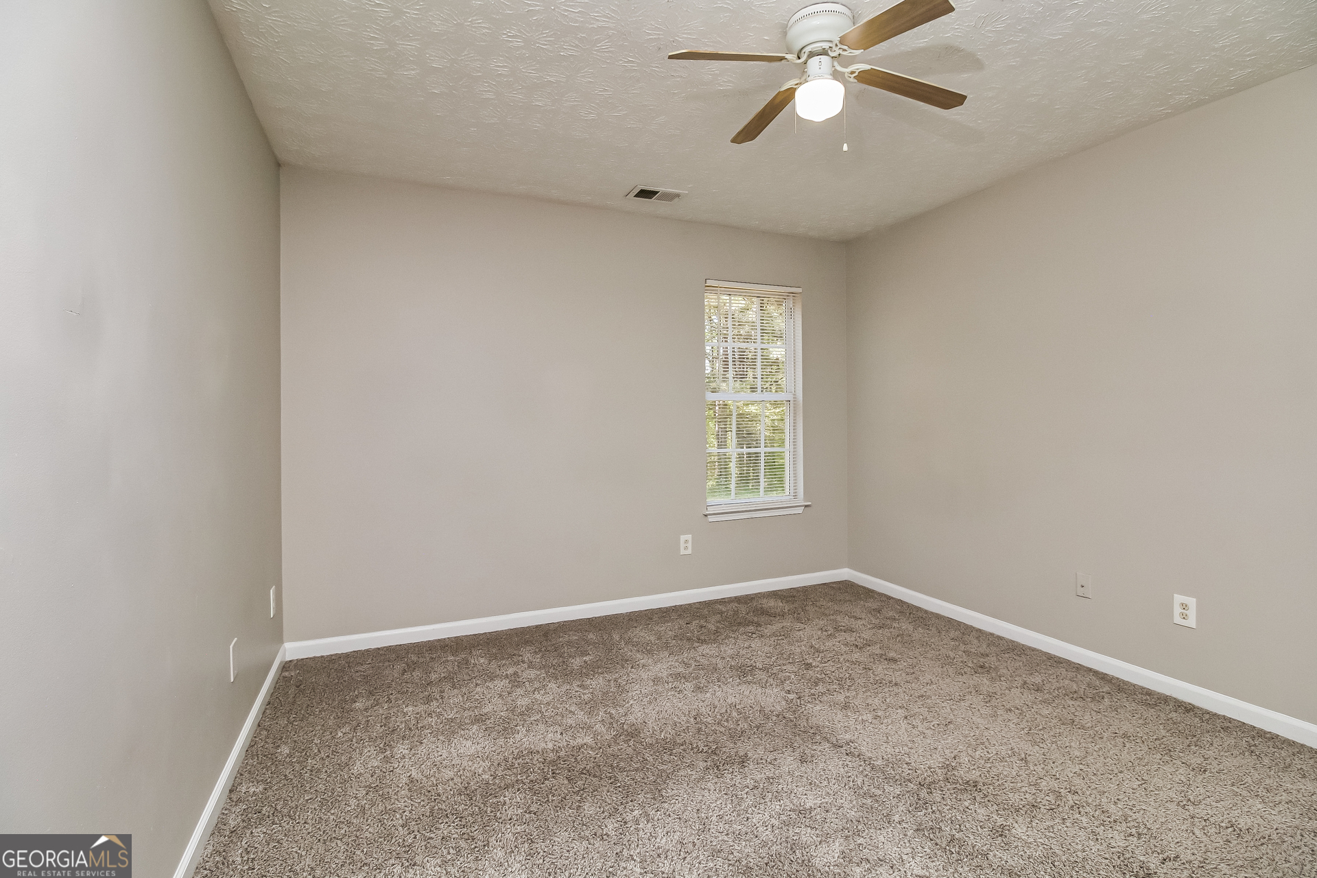 460 Mountainview Drive Covington, GA 30016 - Photo 11 of 15 a view of an empty room with a window