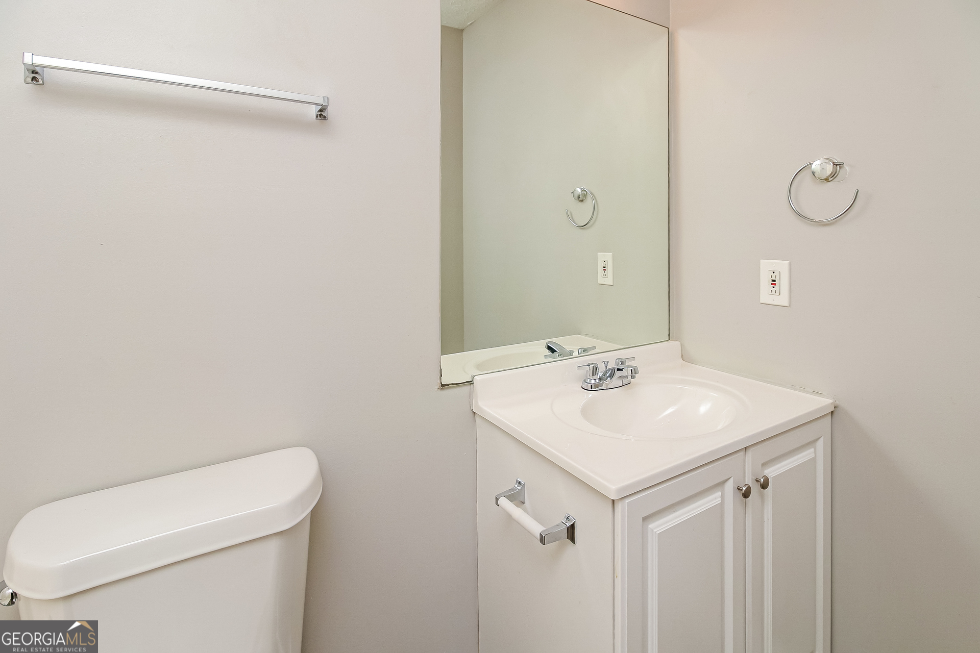 460 Mountainview Drive Covington, GA 30016 - Photo 13 of 15 a bathroom with a sink a toilet and a mirror