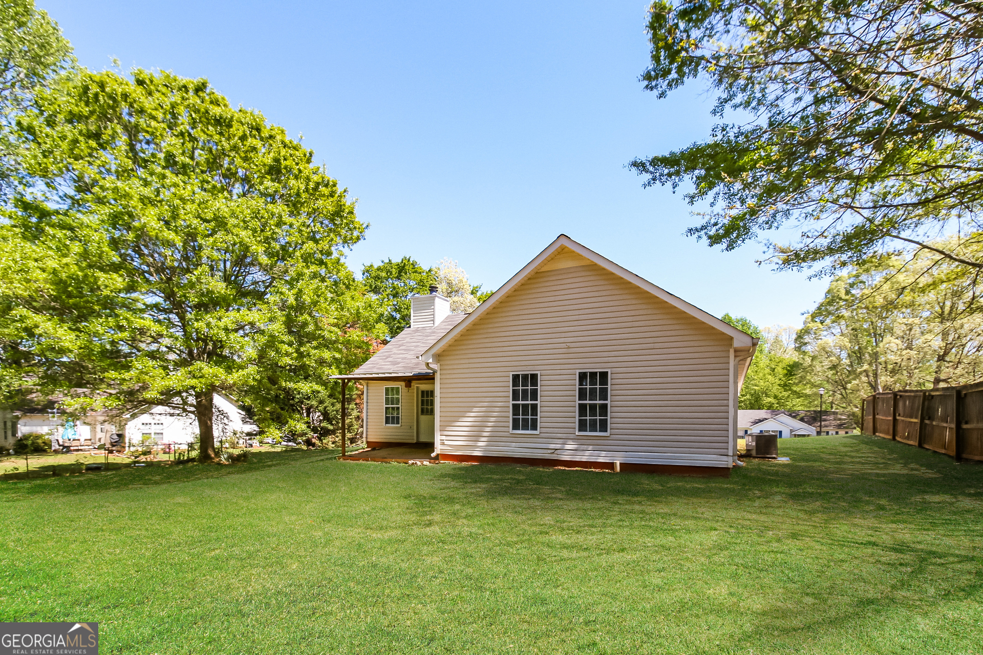 460 Mountainview Drive Covington, GA 30016 - Photo 15 of 15 a view of a backyard with large trees