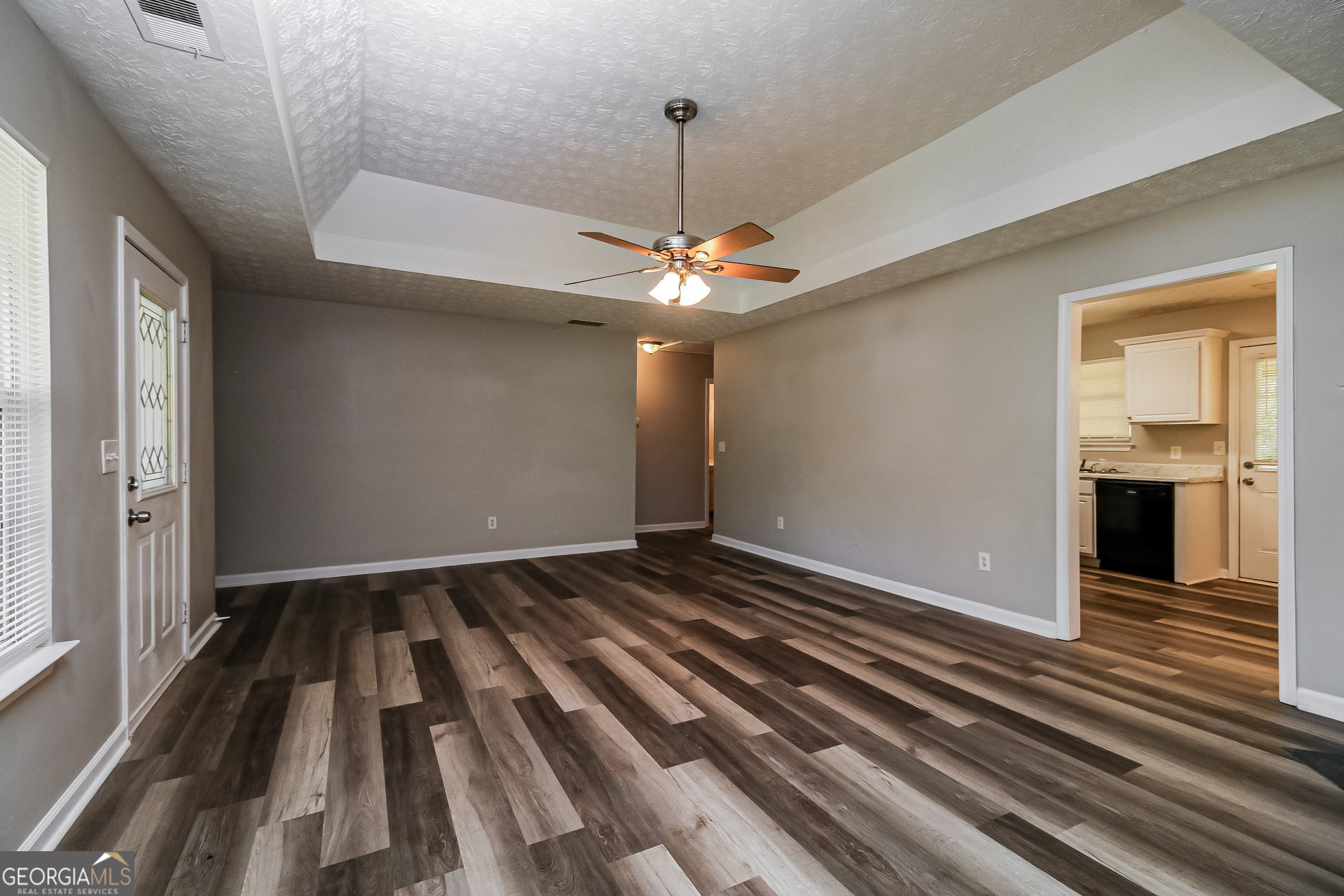460 Mountainview Drive Covington, GA 30016 - Photo 2 of 15 wooden floor in an empty room with a window