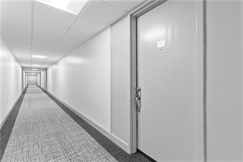 130 26th Street Northwest, Unit 307 Atlanta, GA 30309 - Photo 11 of 12 a view of a hallway