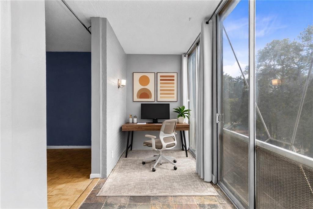 130 26th Street Northwest, Unit 307 Atlanta, GA 30309 - Photo 7 of 12 a dining room with a table and chairs