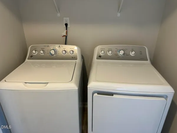 a bathroom with a toilet and shower