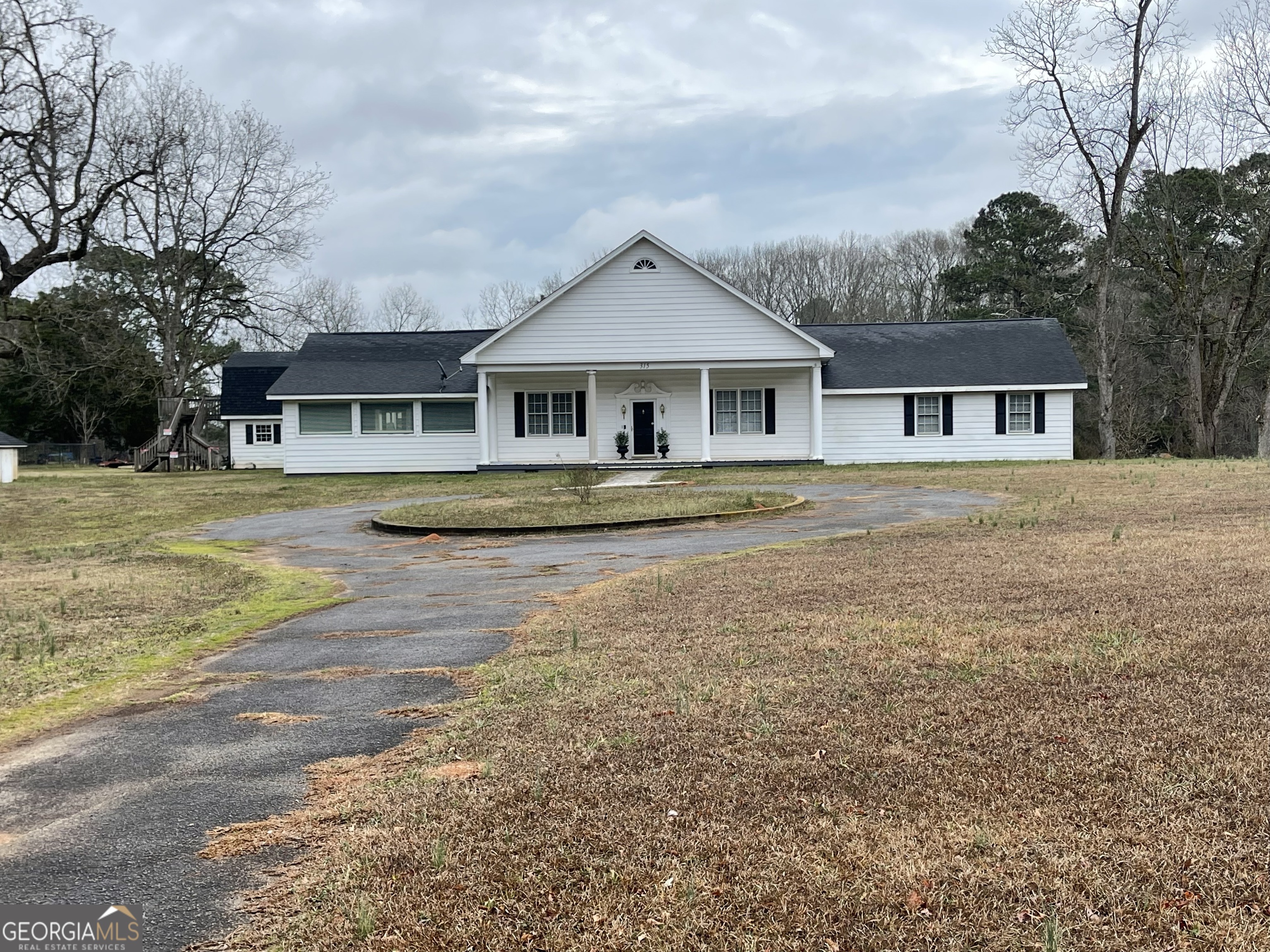 315 Wilder Road Griffin, GA 30224 - Photo 1 of 2 a front view of a house with a yard and trees