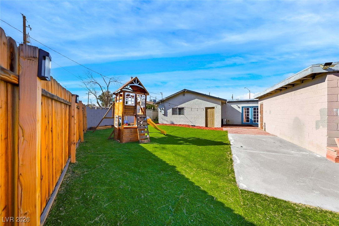 111 Copper Street Henderson, NV 89015 - Photo 15 of 47 Fenced backyard with a playground