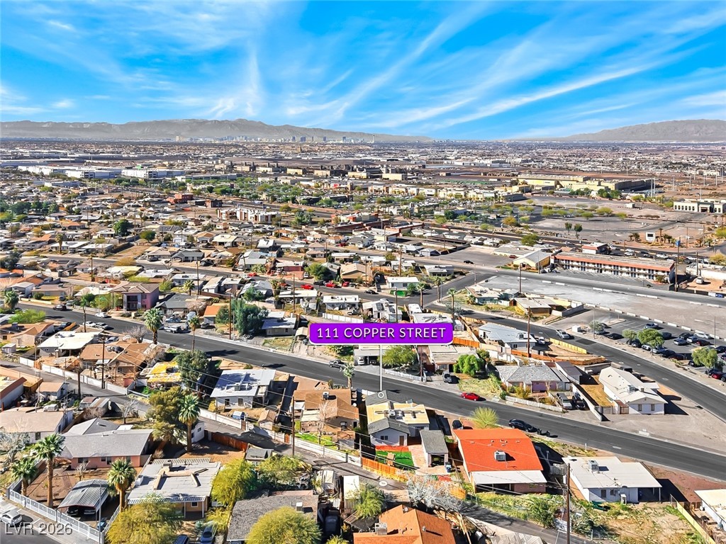 111 Copper Street Henderson, NV 89015 - Photo 18 of 47 Aerial overview of property's location featuring a mountain backdrop and nearby suburban area