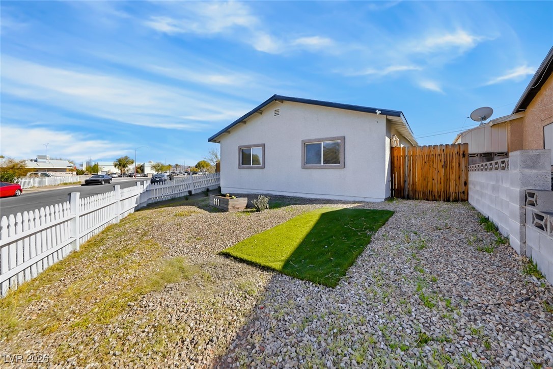 111 Copper Street Henderson, NV 89015 - Photo 25 of 47 Back of property featuring a fenced backyard and stucco siding