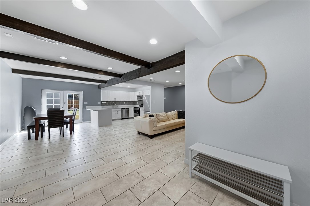 111 Copper Street Henderson, NV 89015 - Photo 30 of 47 Living room with recessed lighting, beamed ceiling, and light tile patterned floors
