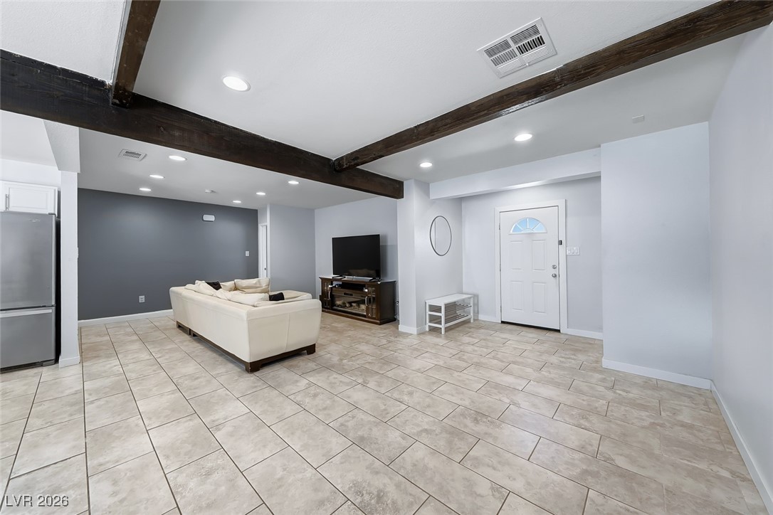 111 Copper Street Henderson, NV 89015 - Photo 32 of 47 Living room with recessed lighting and beamed ceiling