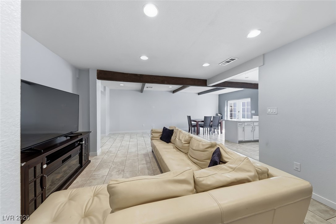 111 Copper Street Henderson, NV 89015 - Photo 33 of 47 Living room featuring recessed lighting and beamed ceiling