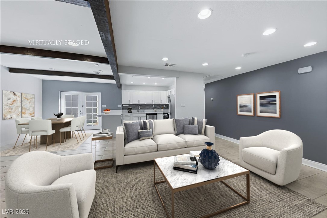 111 Copper Street Henderson, NV 89015 - Photo 4 of 47 Tiled living room featuring recessed lighting, french doors, and beam ceiling