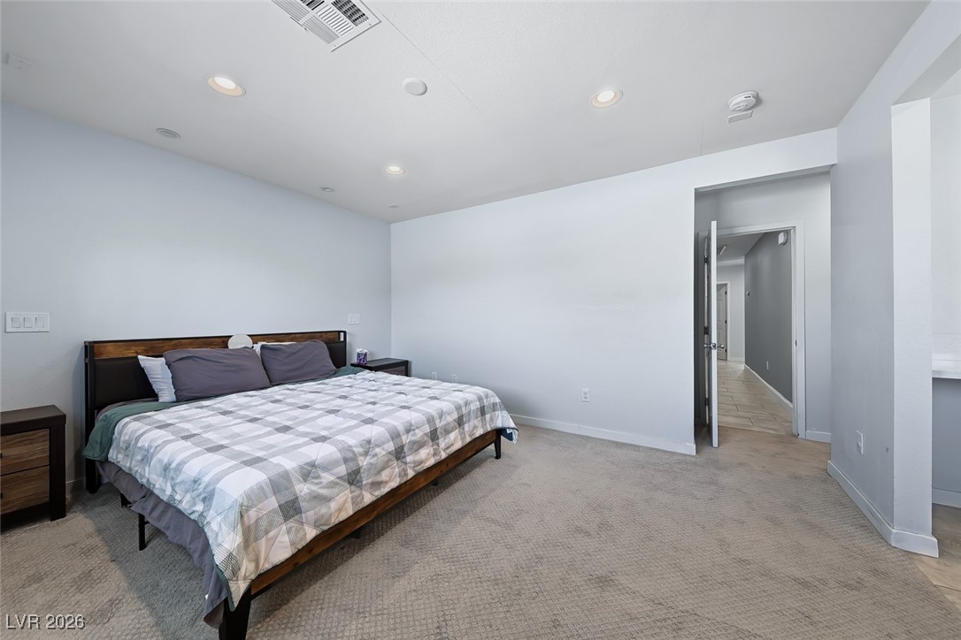 111 Copper Street Henderson, NV 89015 - Photo 40 of 47 Bedroom with light carpet and recessed lighting