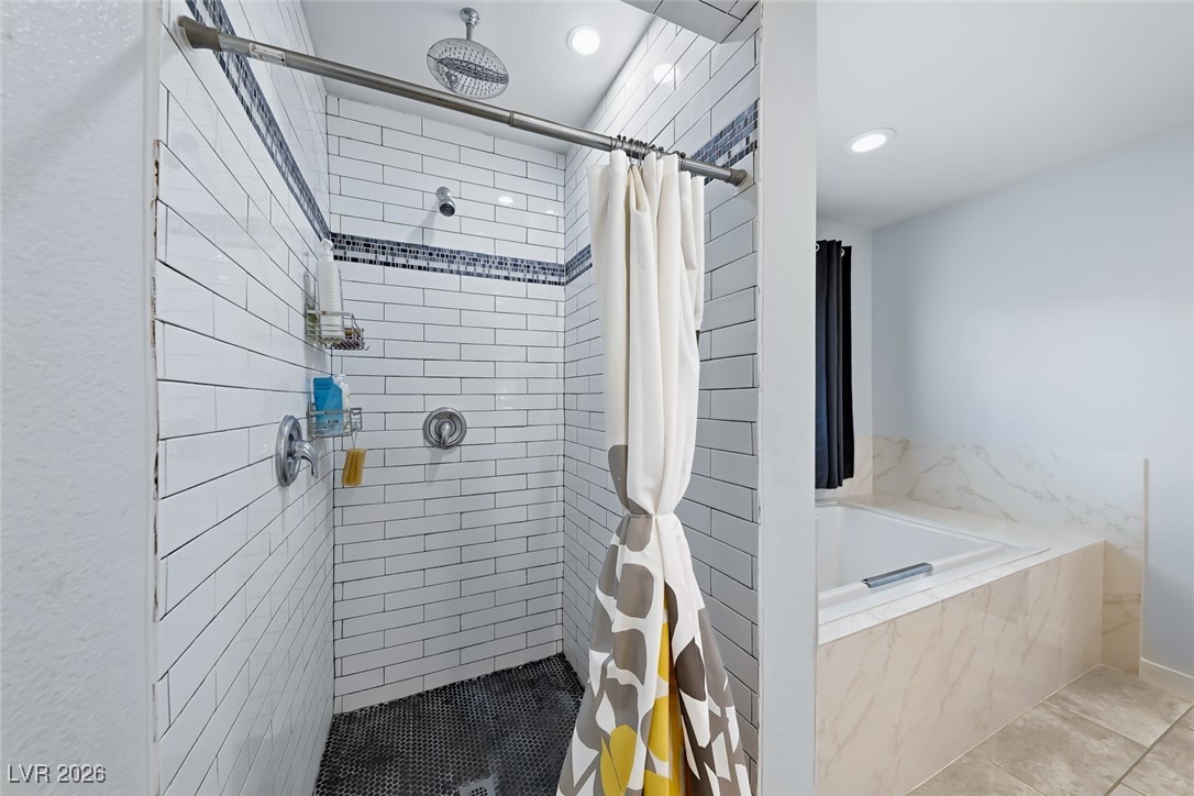 111 Copper Street Henderson, NV 89015 - Photo 44 of 47 Full bathroom featuring a stall shower, a garden tub, and recessed lighting