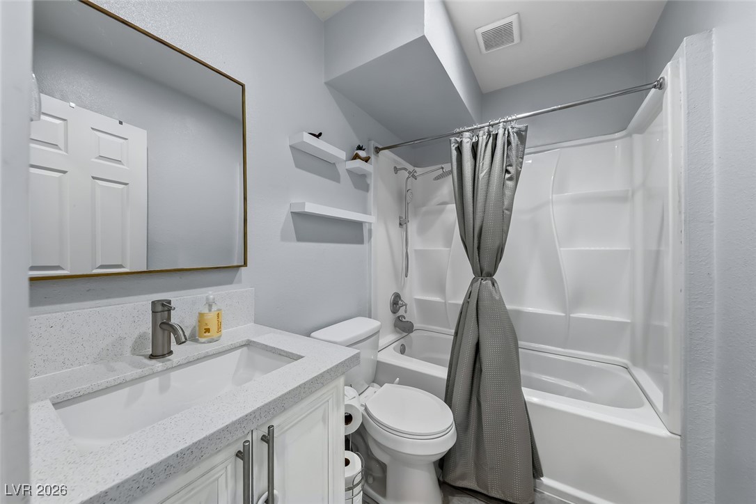 111 Copper Street Henderson, NV 89015 - Photo 10 of 47 Bathroom featuring shower / bath combo with shower curtain and vanity