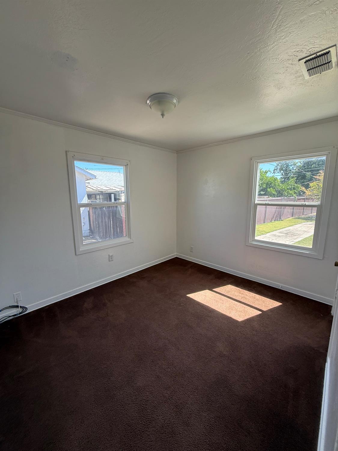 501 Rotan Avenue Madera, CA 93637 - Photo 11 of 23 a view of an empty room with a window