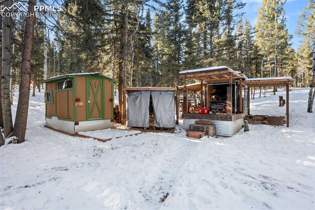 267 Kutsu Ridge Road Florissant, CO 80816 - Photo 16 of 26 a view of a outdoor space with a patio and a garden