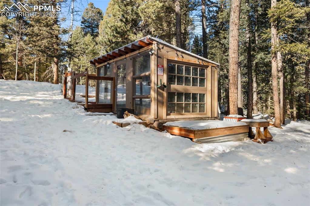 267 Kutsu Ridge Road Florissant, CO 80816 - Photo 17 of 26 a view of a house with pool and sitting area