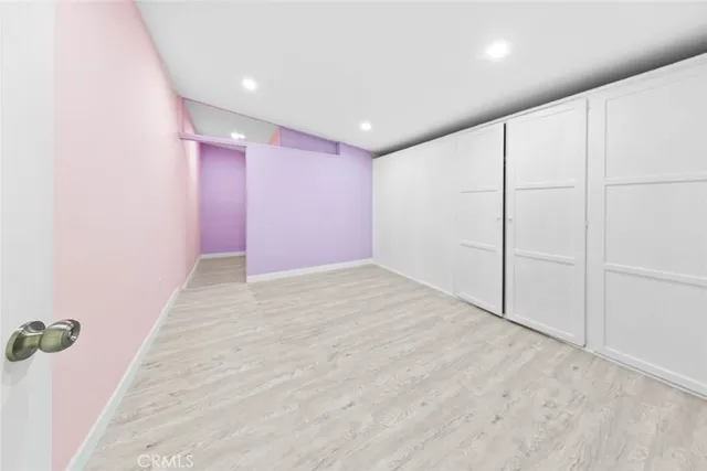 an empty room with a empty space and windows