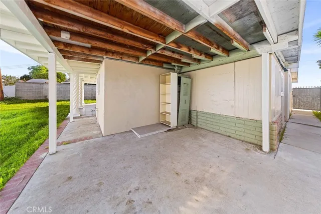 a view of a room with wooden walls