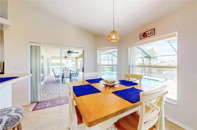 a view of a dining room with furniture wooden floor and a chandelier