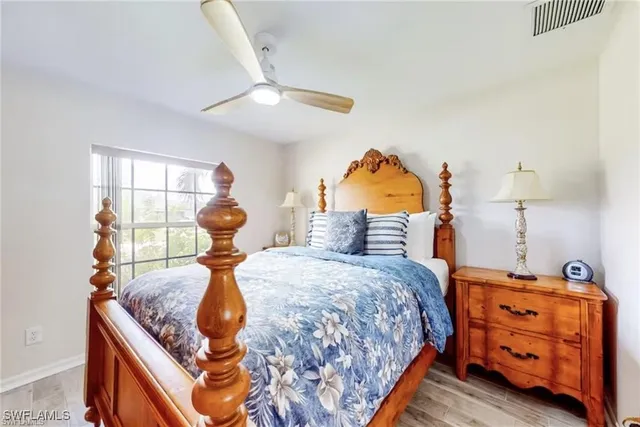 a bed room with a bed and a chandelier