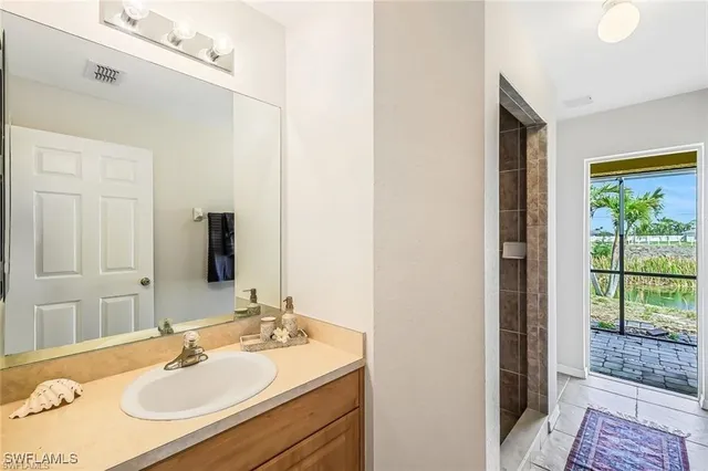a bathroom with a sink and a mirror