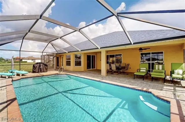 a view of a backyard with sitting area