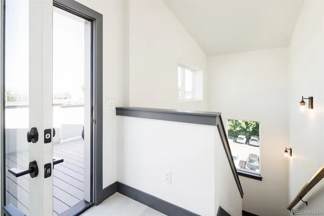 a view of an entryway with wooden floor
