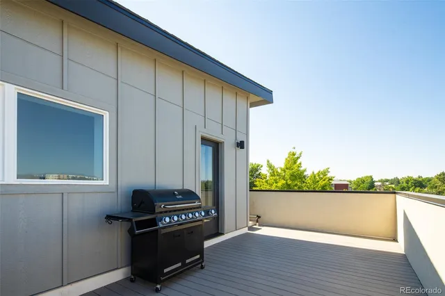a view of a terrace with wooden floor and fence