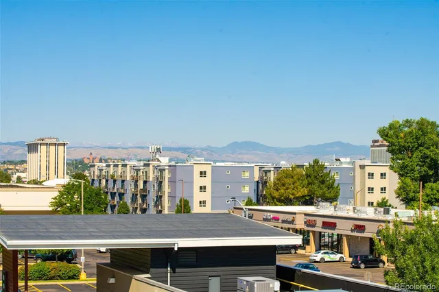 a view of tall buildings from a balcony