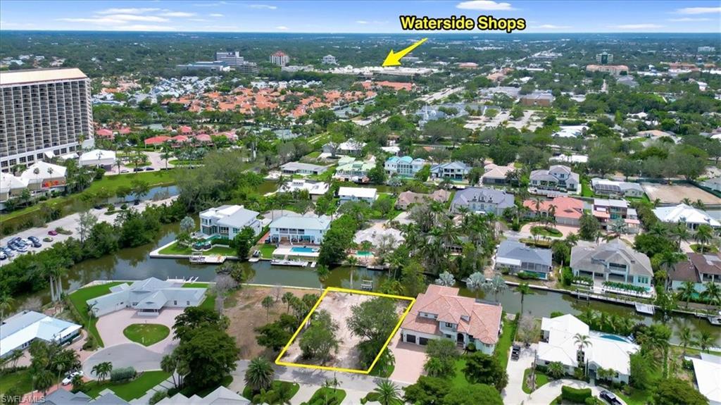 5186 Seashell Avenue Naples, FL 34103 - Photo 2 of 8 an aerial view of residential houses with outdoor space and swimming pool