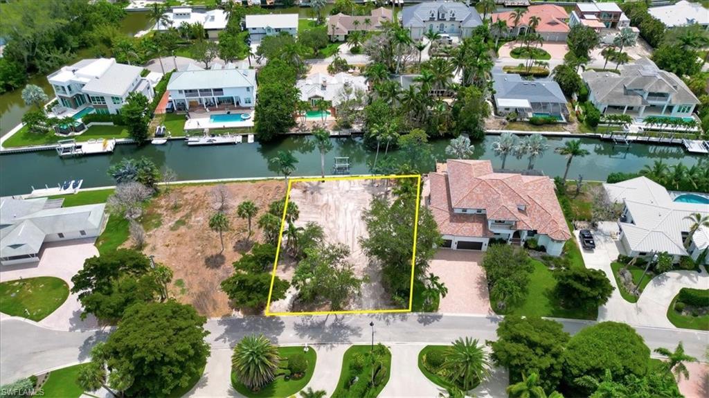 5186 Seashell Avenue Naples, FL 34103 - Photo 5 of 8 an aerial view of house with yard swimming pool and outdoor seating