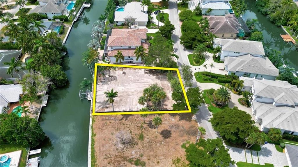 5186 Seashell Avenue Naples, FL 34103 - Photo 7 of 8 an aerial view of residential houses with outdoor space and street view