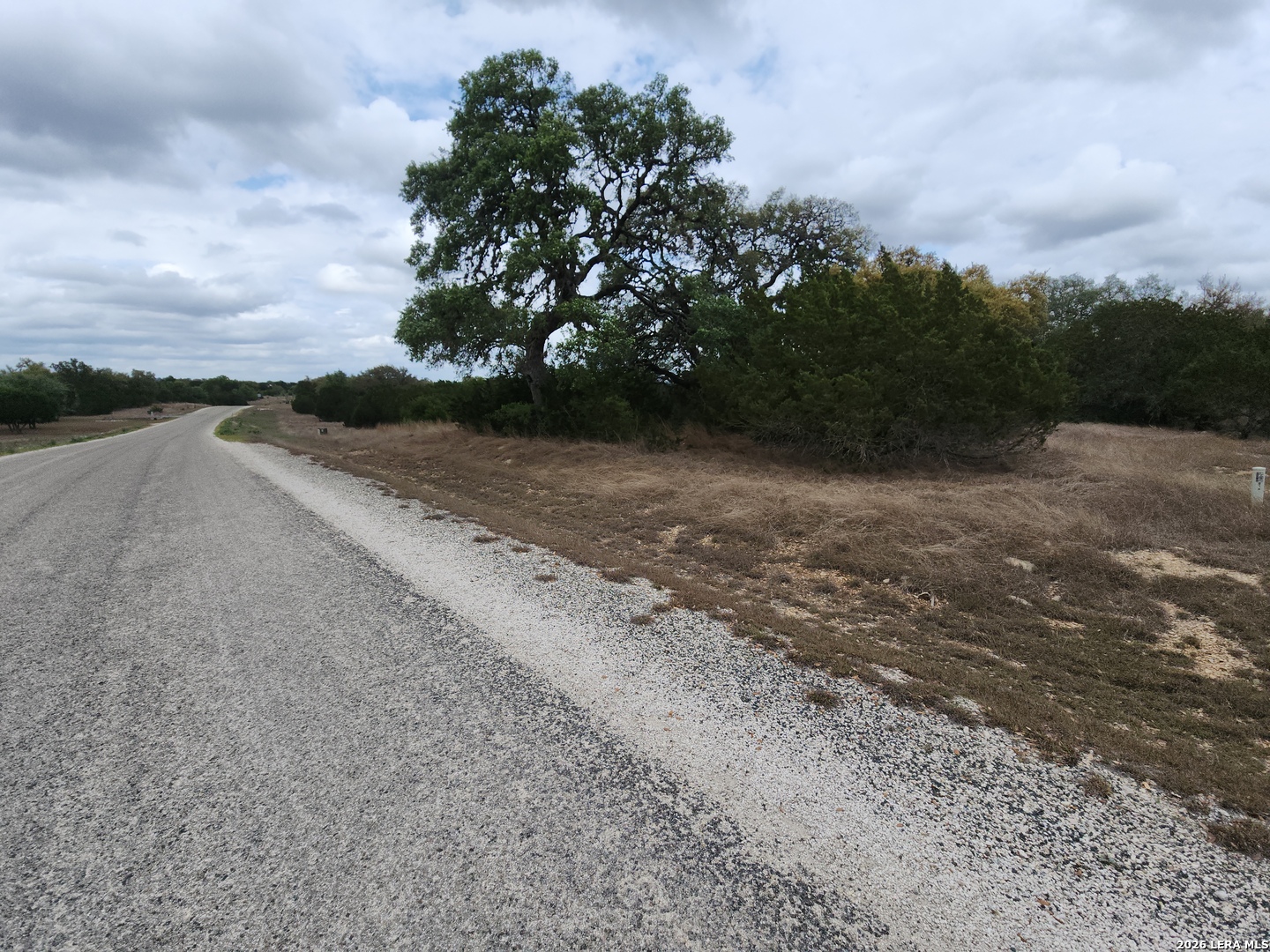 Tbd Buckskin Bandera, TX 78003 - Photo 1 of 6 a view of a road with a yard